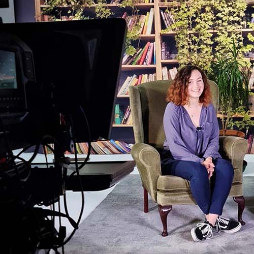 A photograph of a tv studio advert voice over customer.