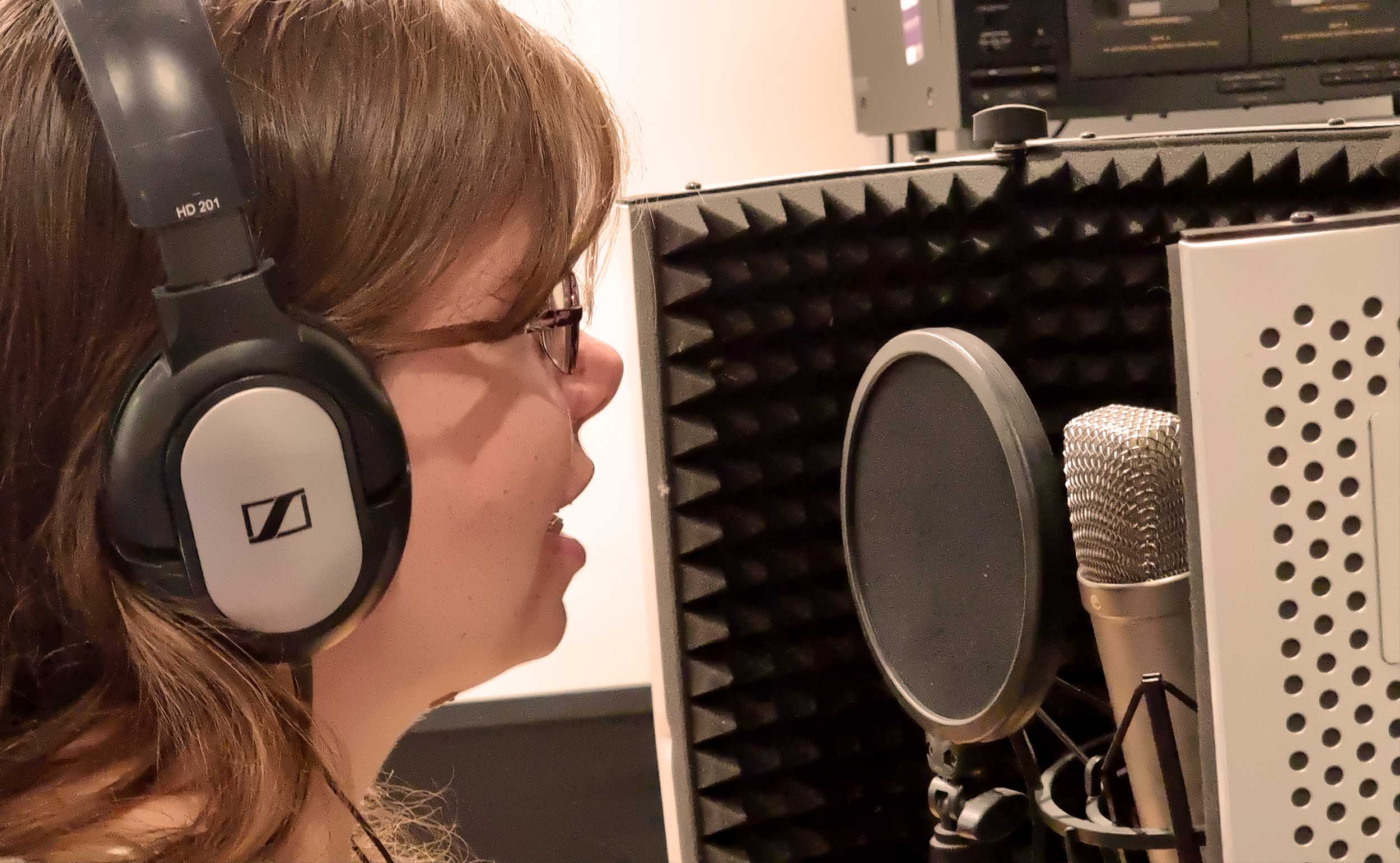 Femaler Advert Voice Over recording photos.